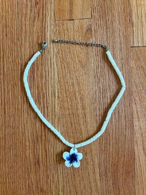Hawaiian Necklace with Puka Shells and White/Blue Flower Pendant